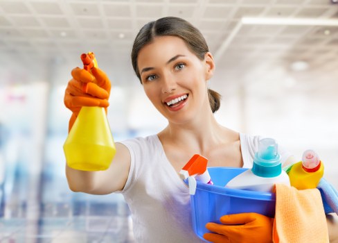 Living room sofa cleaning with upholstery care tools