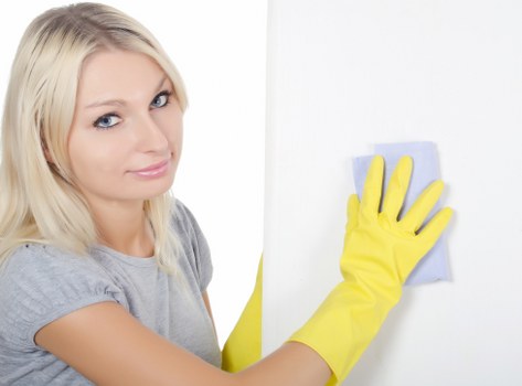 Professional cleaner maintaining shared staircase